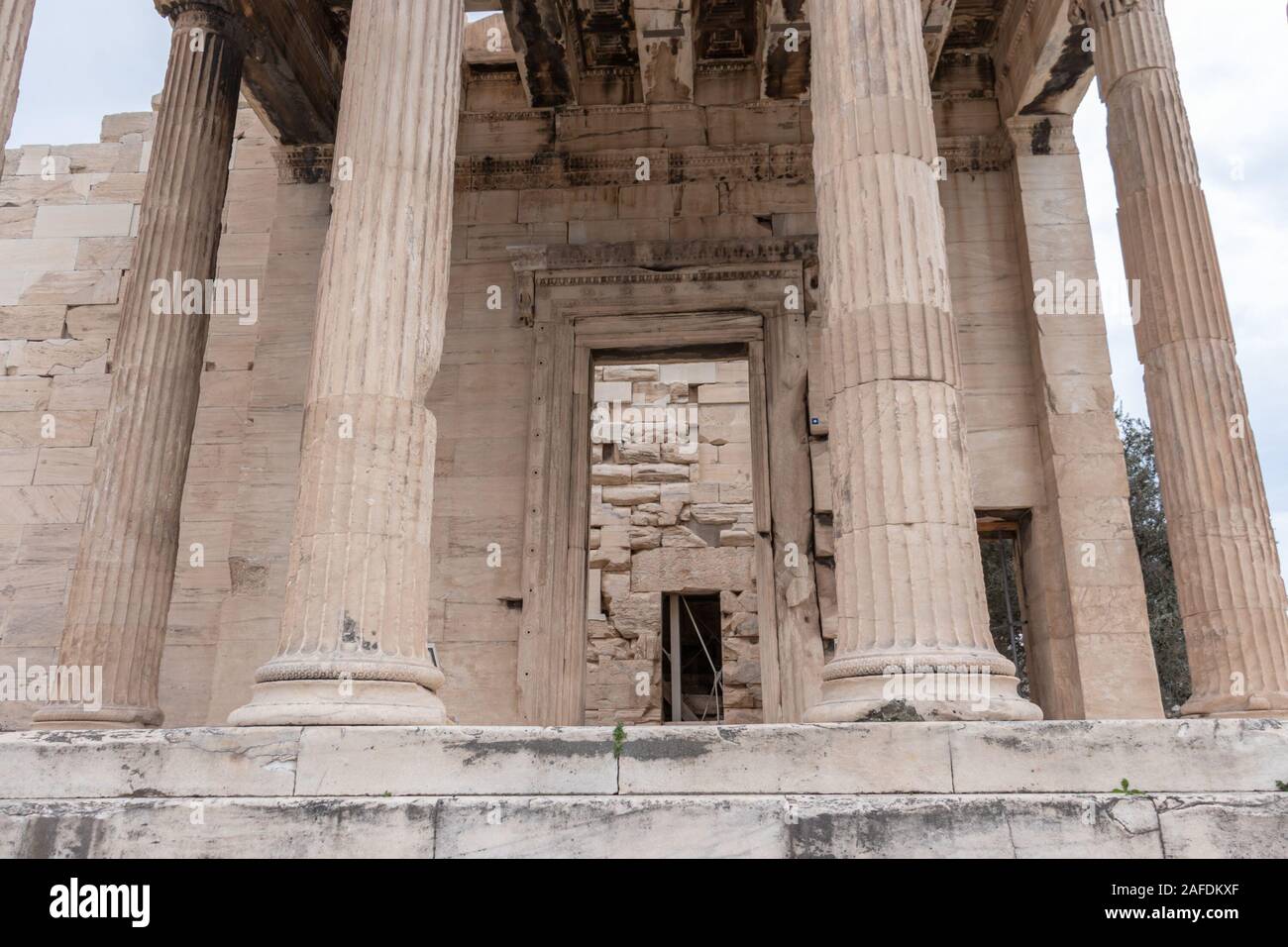Erechtheion or Erechtheum ancient Greek temple on the north side of the Acropolis of Athens in Greece dedicated to Athena and Poseidon. Stock Photo