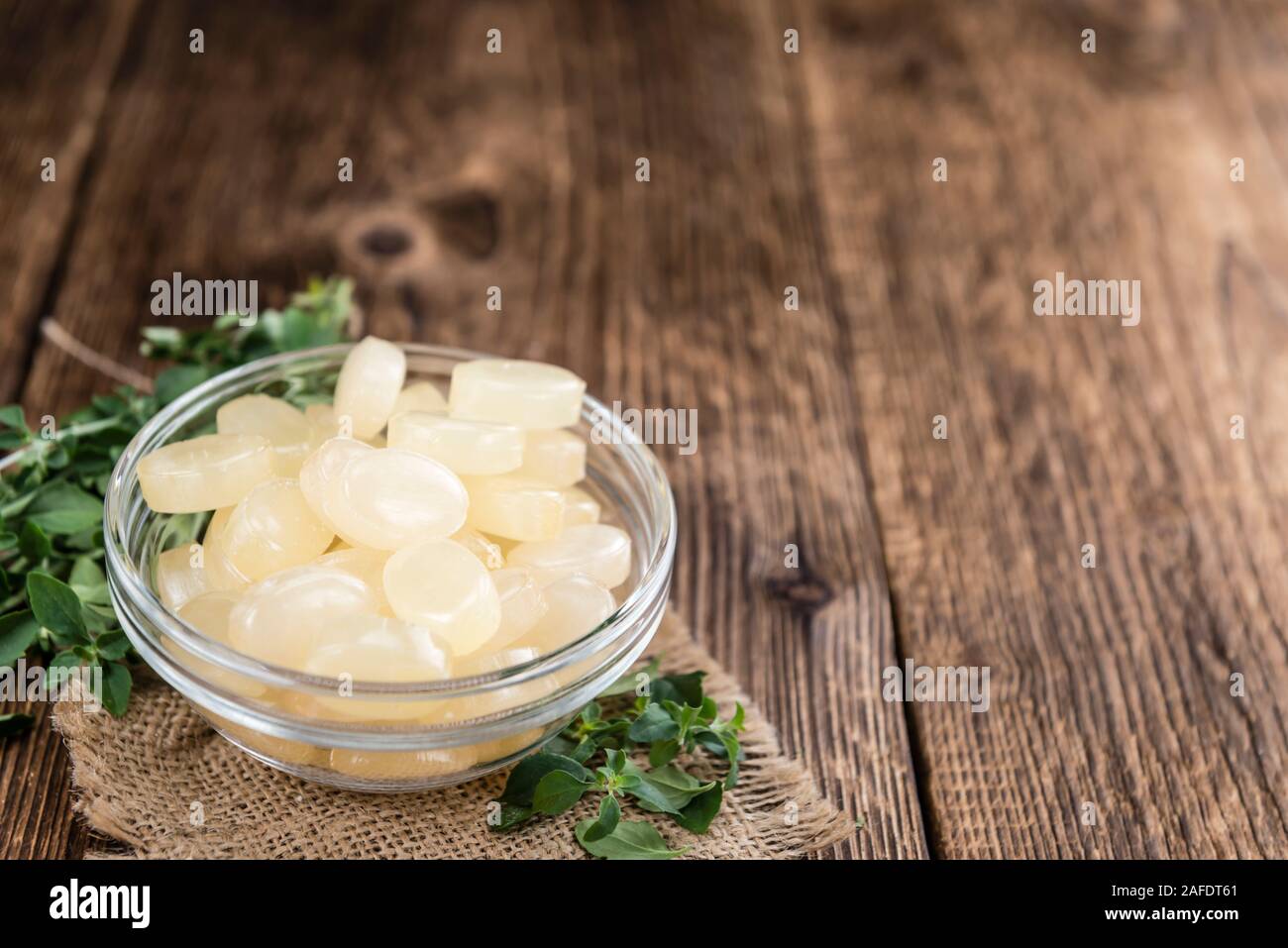 Wooden table with Menthol Candies (selective focus; close-up shot) Stock Photo