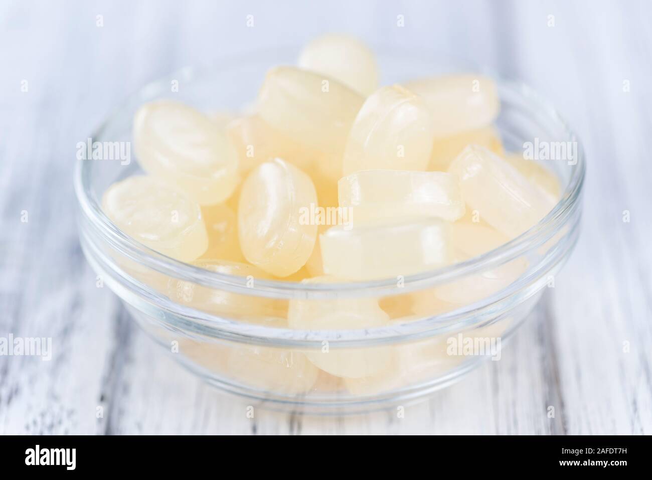 Wooden table with Menthol Candies (selective focus; close-up shot) Stock Photo