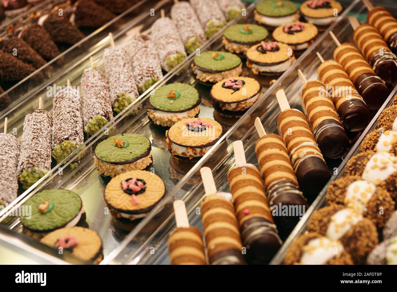 Various sweet items in window display in bakery or supermarket Stock Photo