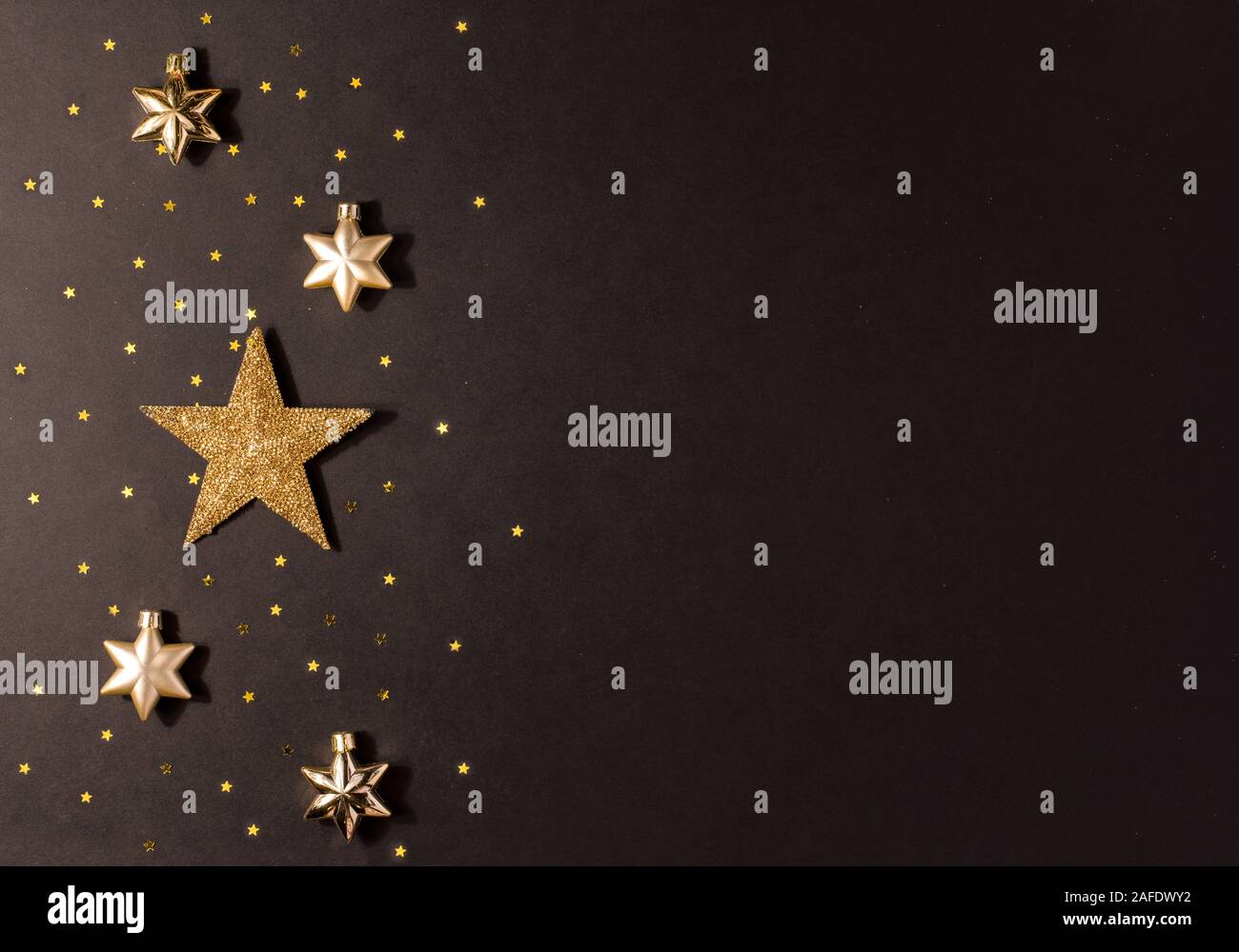 Gold star on a black background Stock Photo Alamy