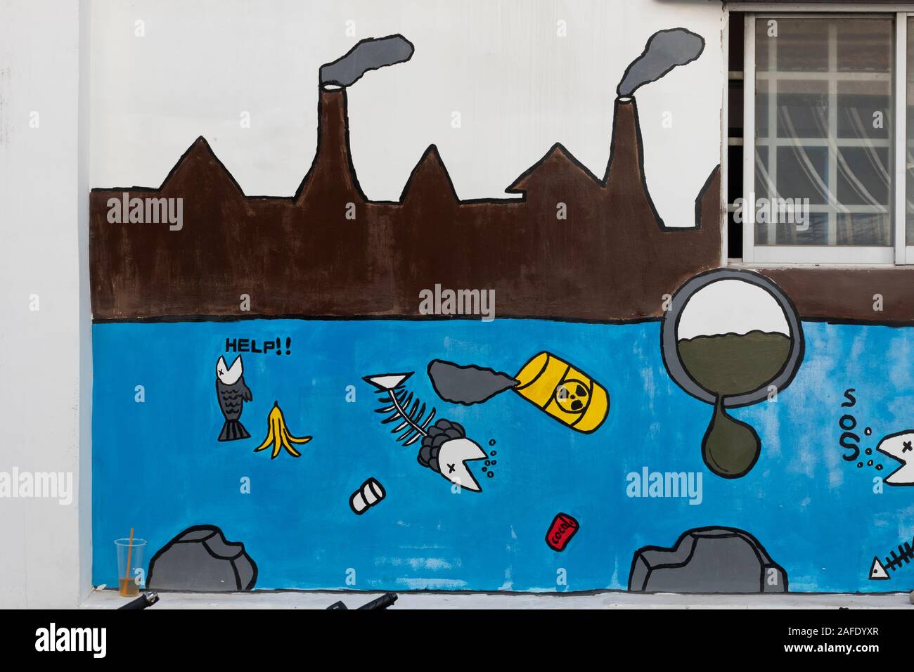 Dead fish from toxic water pollution as the subject of street art mural