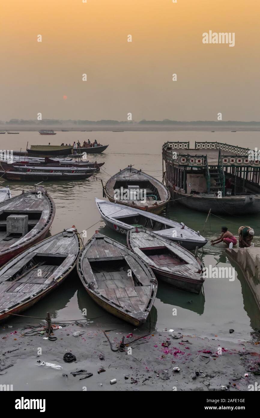 Small wooden boats at the Ganges river in Varanasi, India Stock Photo