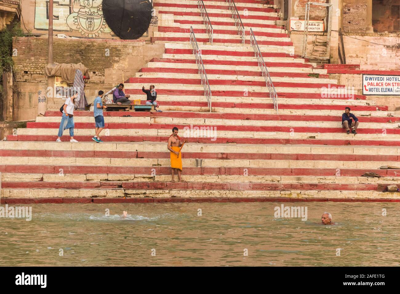 People bathing in the river Ganges at the Chousati Ghat in Varanasi, India Stock Photo