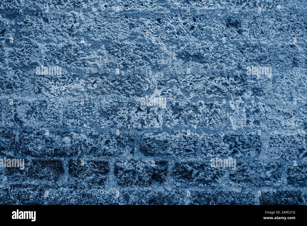 Background of stone wall. Classic Blue abstract background. Color of the year 2020. Stock Photo