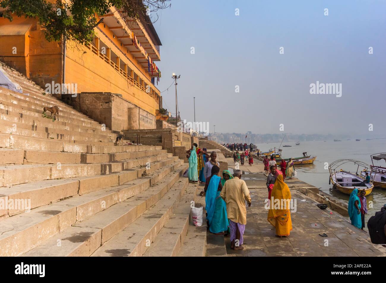 People at the stairs leading to the Ganges river in Varanasi, India Stock Photo