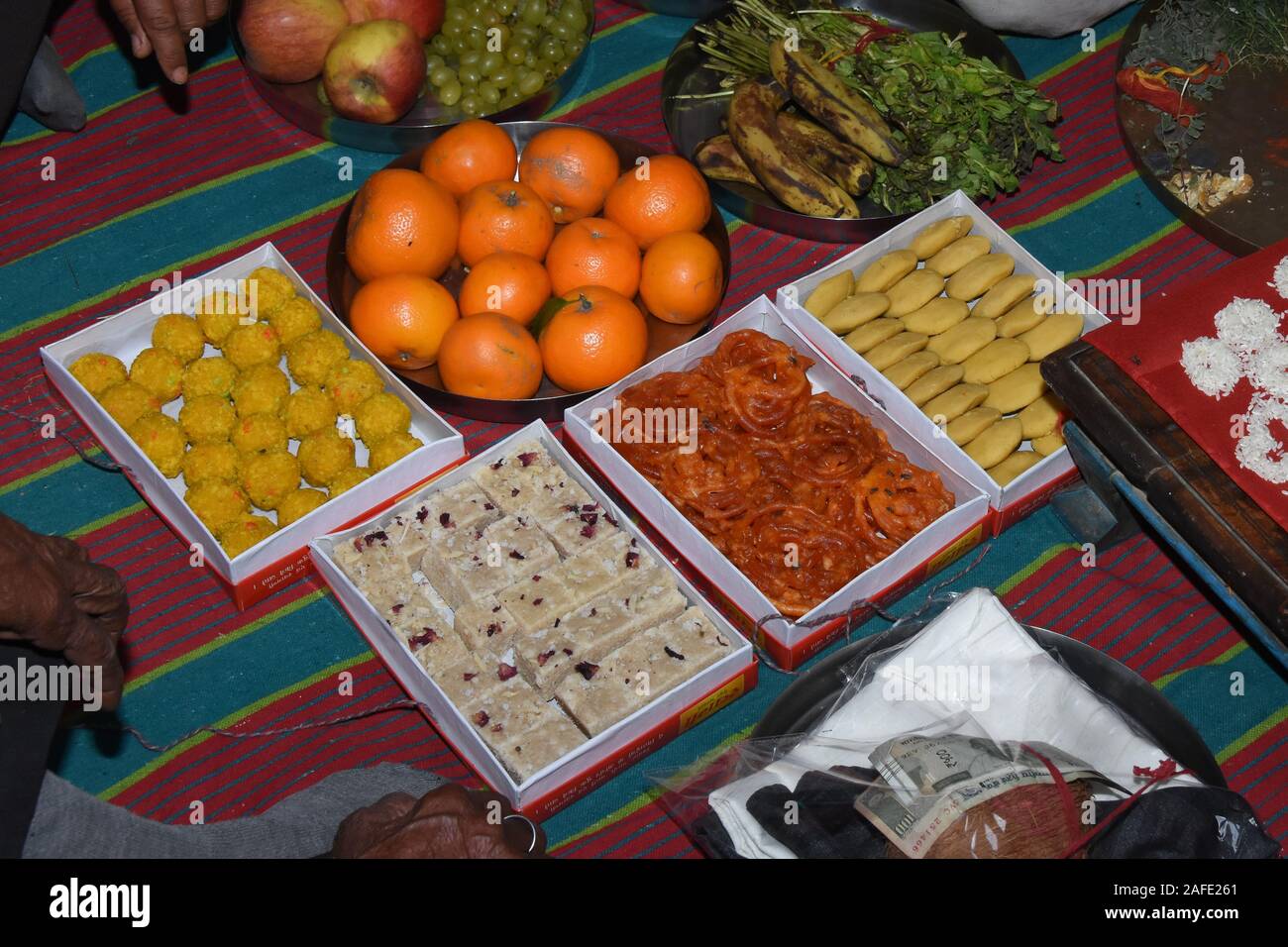 Orange banana khar raisins and cashew nuts in Shagun at Indian wedding Stock Photo