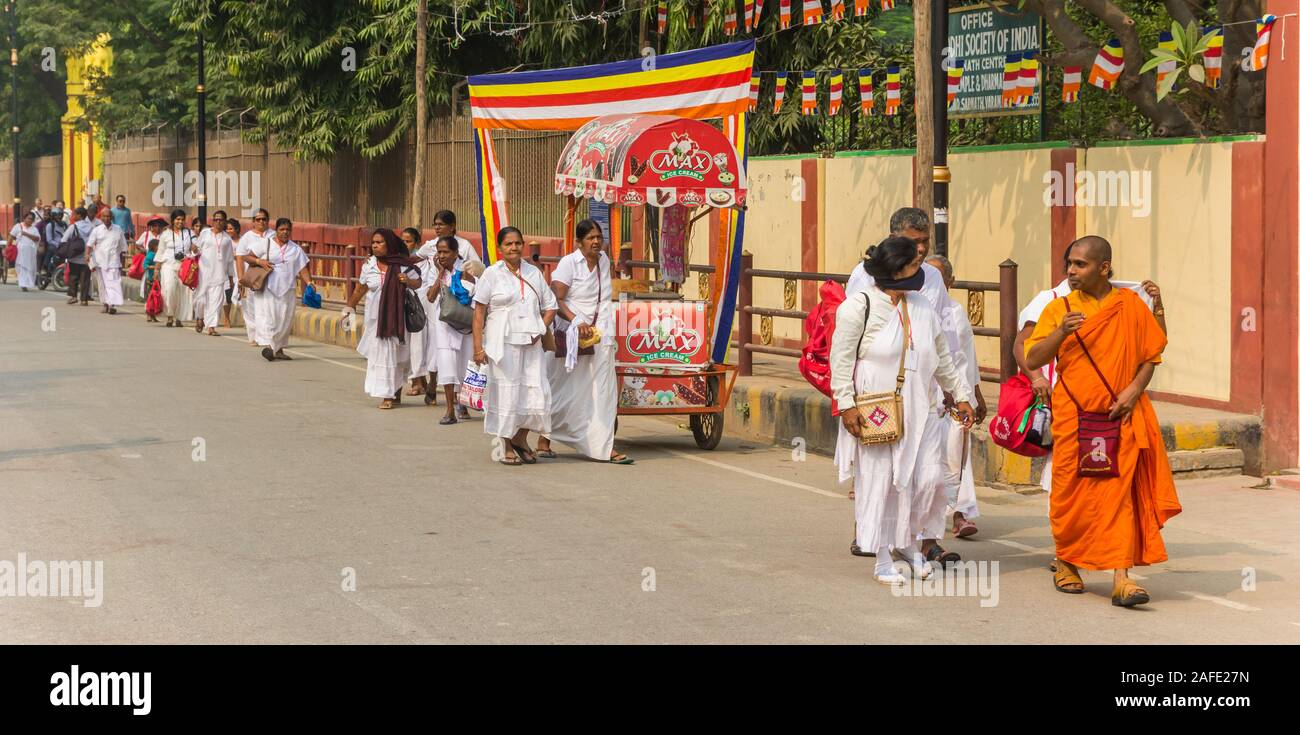 Panorama of buddhists walking in the streets of Sarnath, India Stock Photo