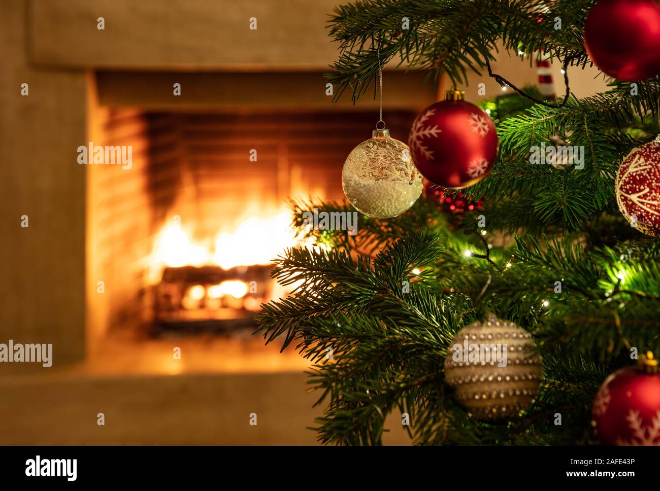 Real christmas tree by fireplace hires stock photography and images