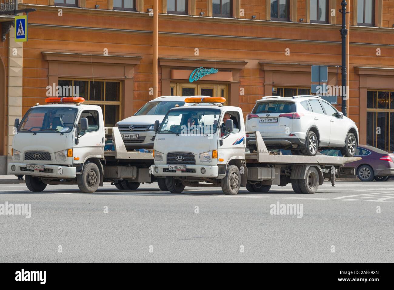 ST. PETERSBURG, RUSSIA-APRIL 10, 2017: Two Hyundai HD78 tow trucks close-up Sunny day Stock Photo