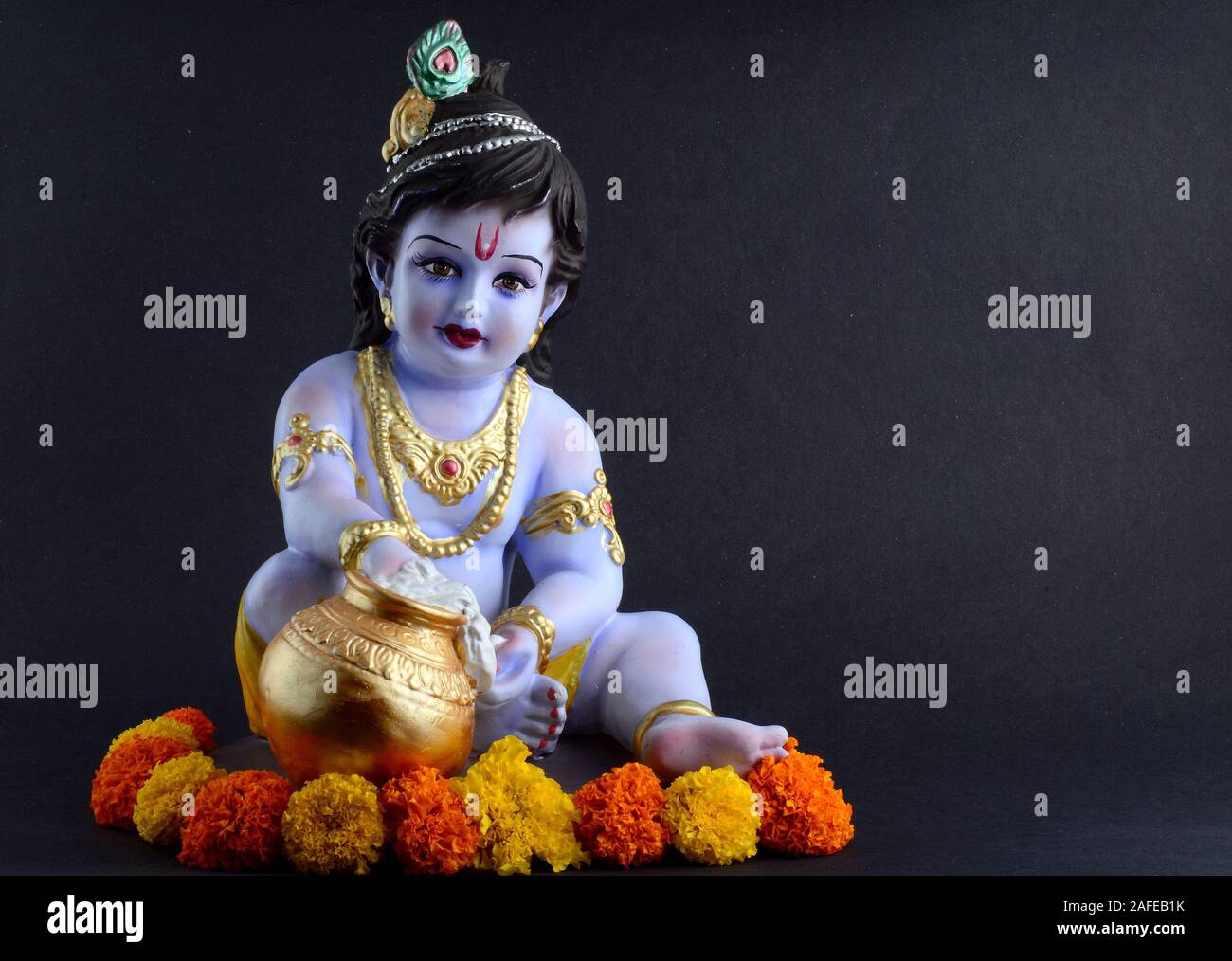 Hindu God Krishna on dark background Stock Photo - Alamy