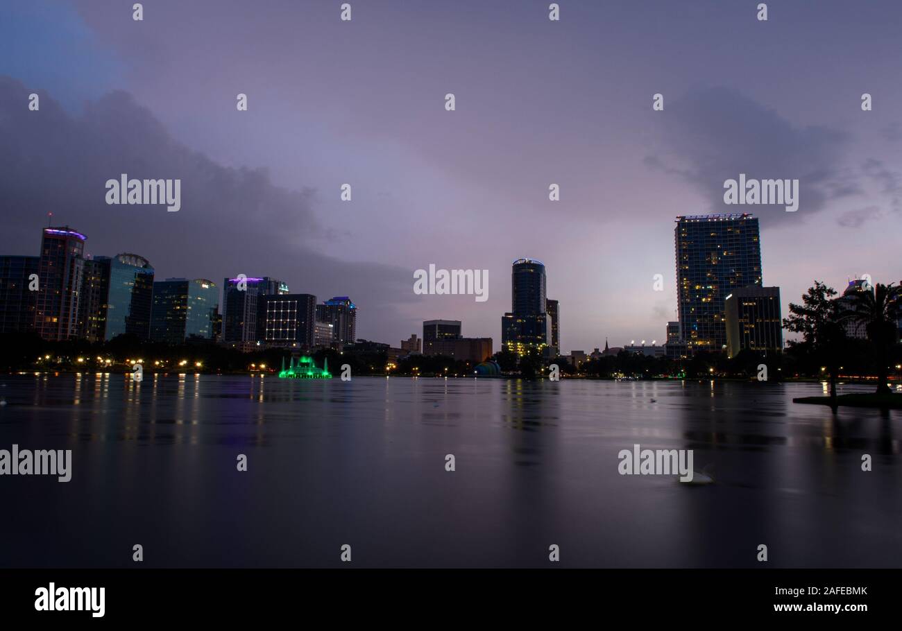A summer thunderstorm at Lake Eola Park with downtown Orlando, Florida. Stock Photo
