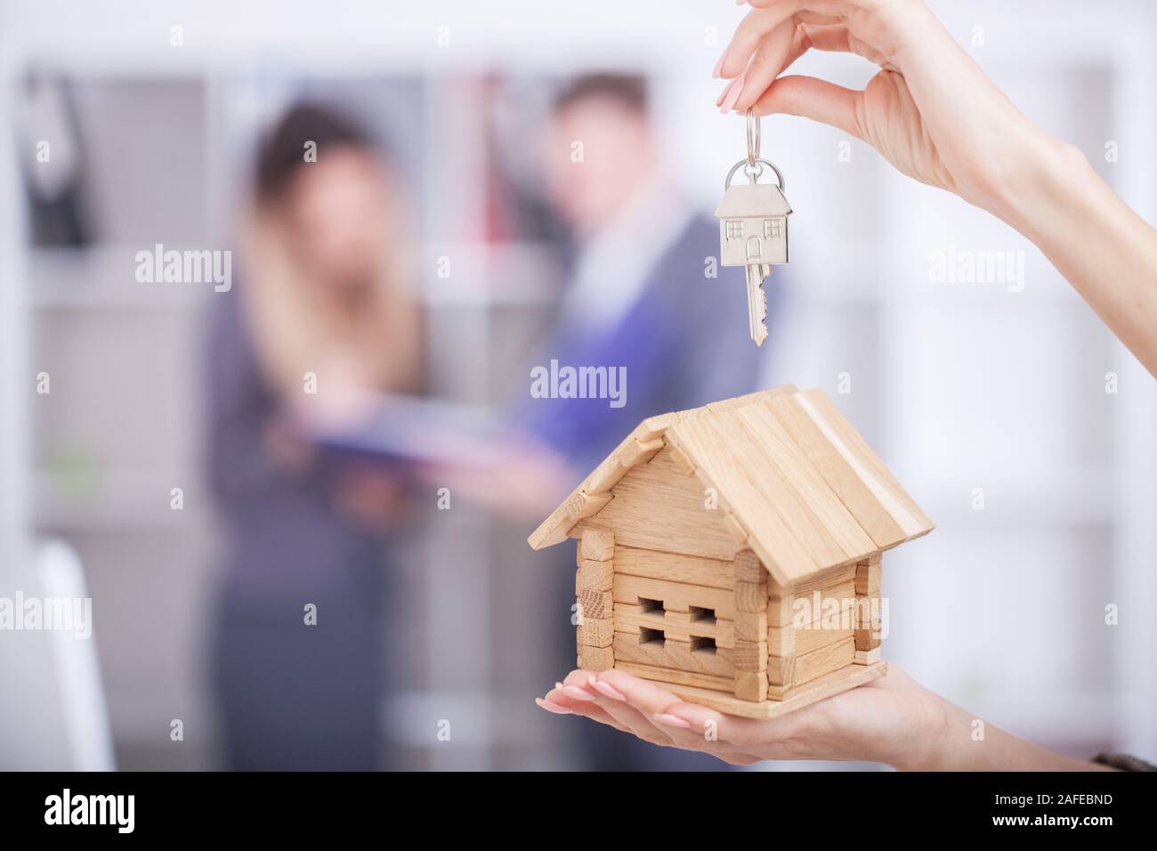 Real estate agent giving house keys to a customer Stock Photo - Alamy