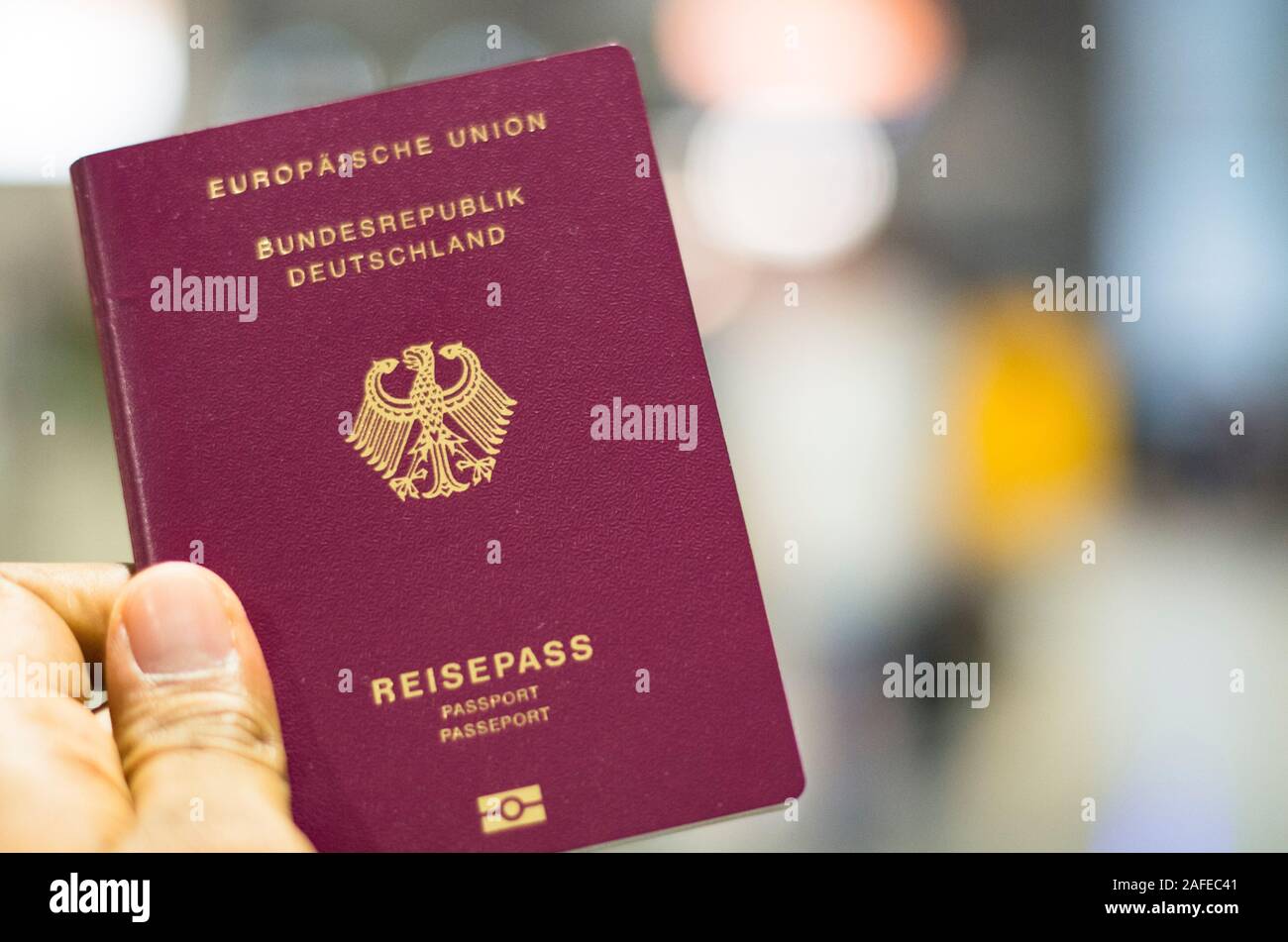 Munich, Germany - September 29 2019: Passenger holding German passport at  the airport in Munich, Germany Stock Photo - Alamy