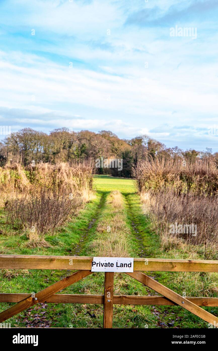 Countryside view with private land sign on gate in Cheshire UK Stock Photo