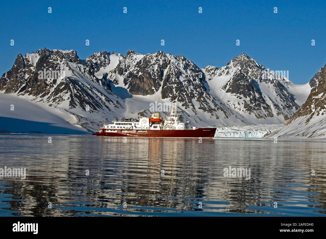 Magdalenefjord at 79 degrees N in north-western Spitsbergen, Svalbard.  the expedition vessle 'Polar Star' is anchored here this early morning in June Stock Photo
