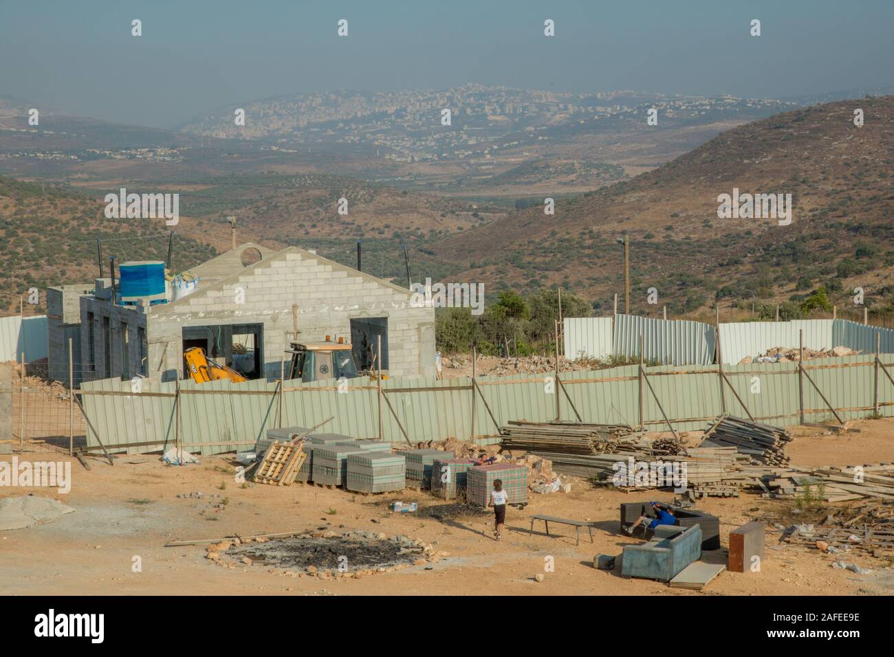 New house are constructed in Einav an Israeli settlement West Bank Israeli children can be seen playing in the construction site Stock Photo