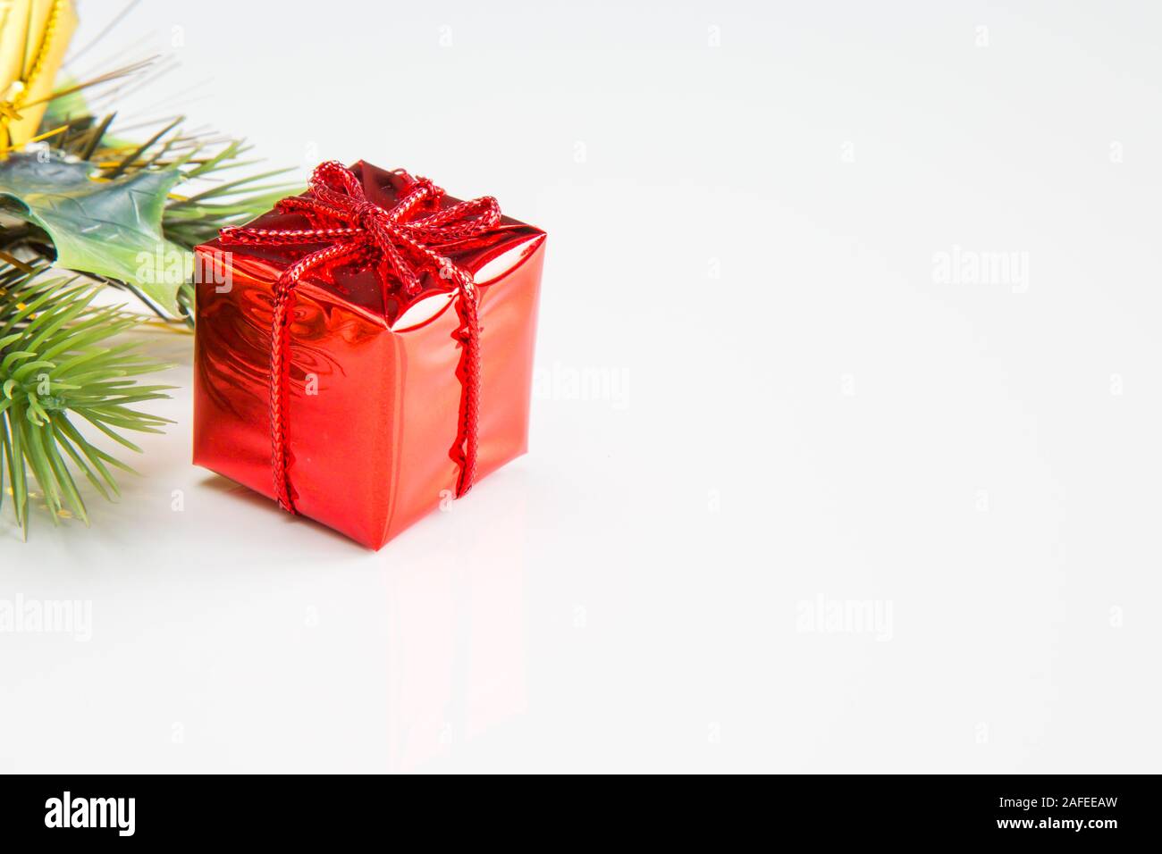 Closeup of red colored Christmas decoration box on white background Stock Photo