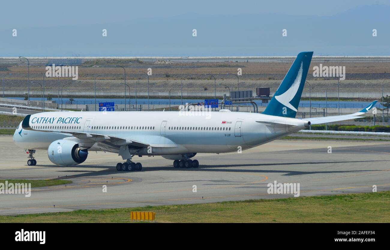Osaka, Japan - Apr 18, 2019.  B-LXF Cathay Pacific Airbus A350-1000 taxiing on runway of Kansai Airport (KIX). Kansai is the 3rd busiest in Japan, wit Stock Photo