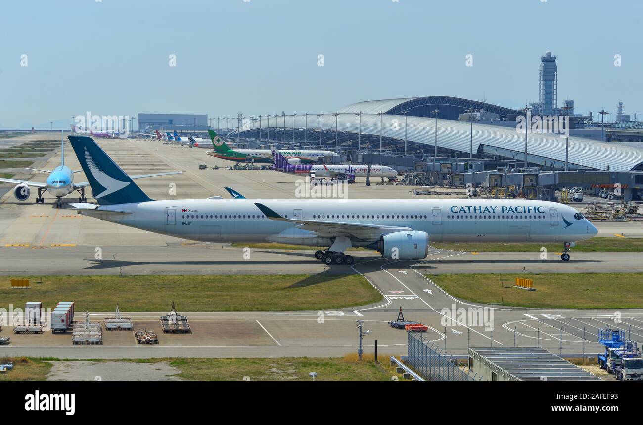 Osaka, Japan - Apr 18, 2019.  B-LXF Cathay Pacific Airbus A350-1000 taxiing on runway of Kansai Airport (KIX). Kansai is the 3rd busiest in Japan, wit Stock Photo