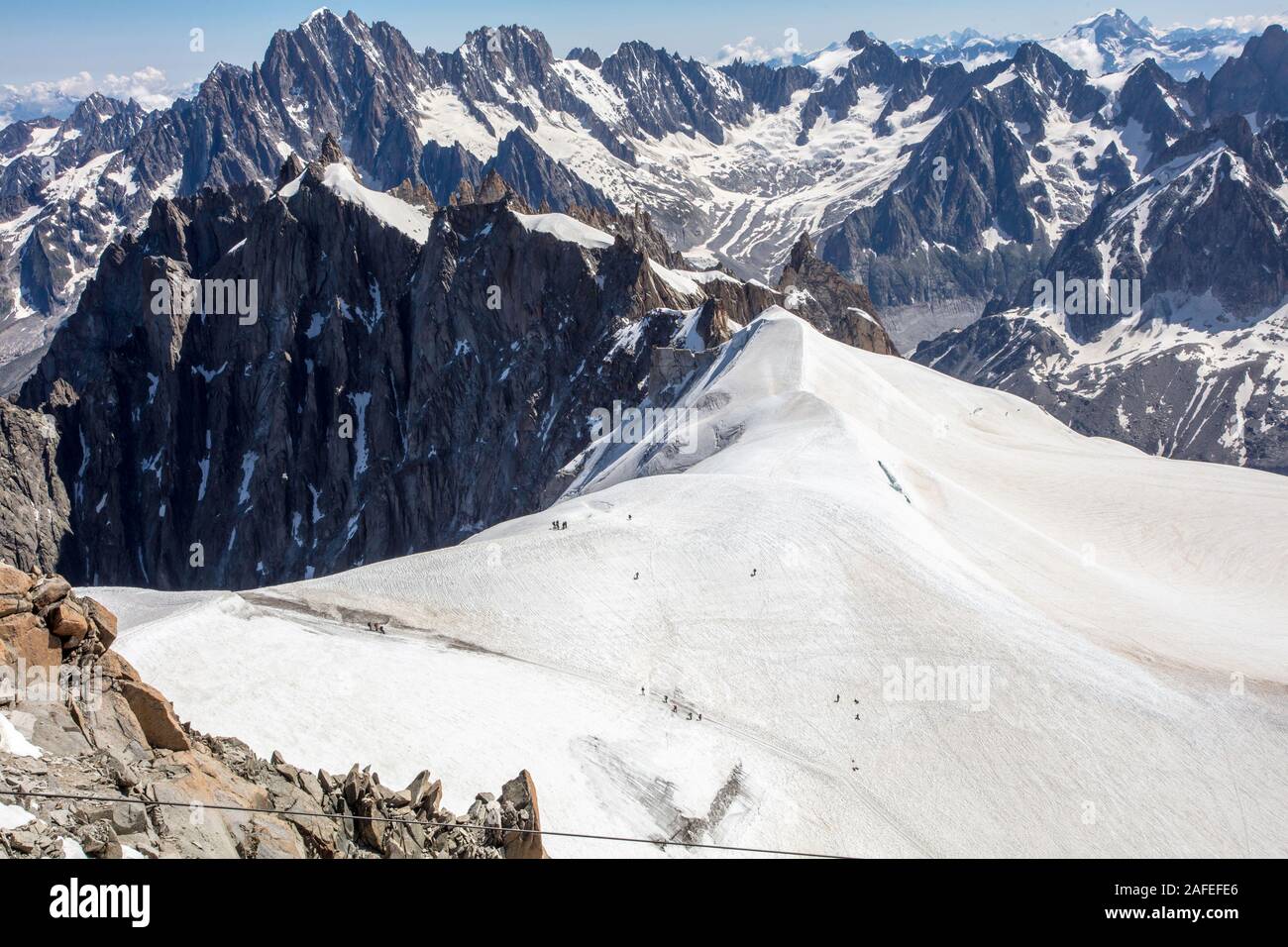 Mountaineers climb to reach the Mont Blanc summit. Aiguille du Midi. Chamonix. France Stock Photo