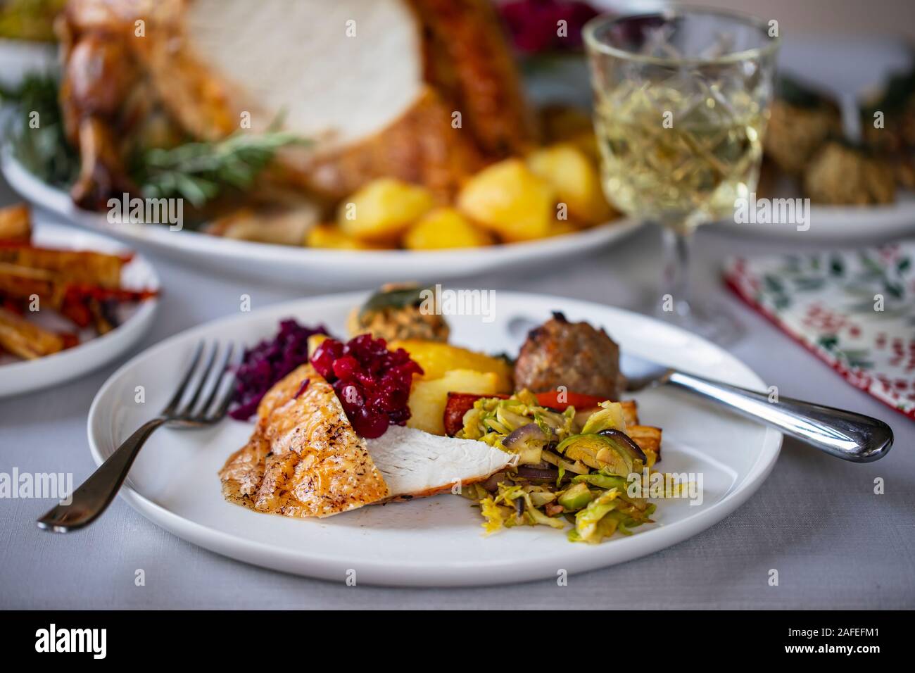 Christmas dinner with roast turkey crown and vegetables Stock Photo