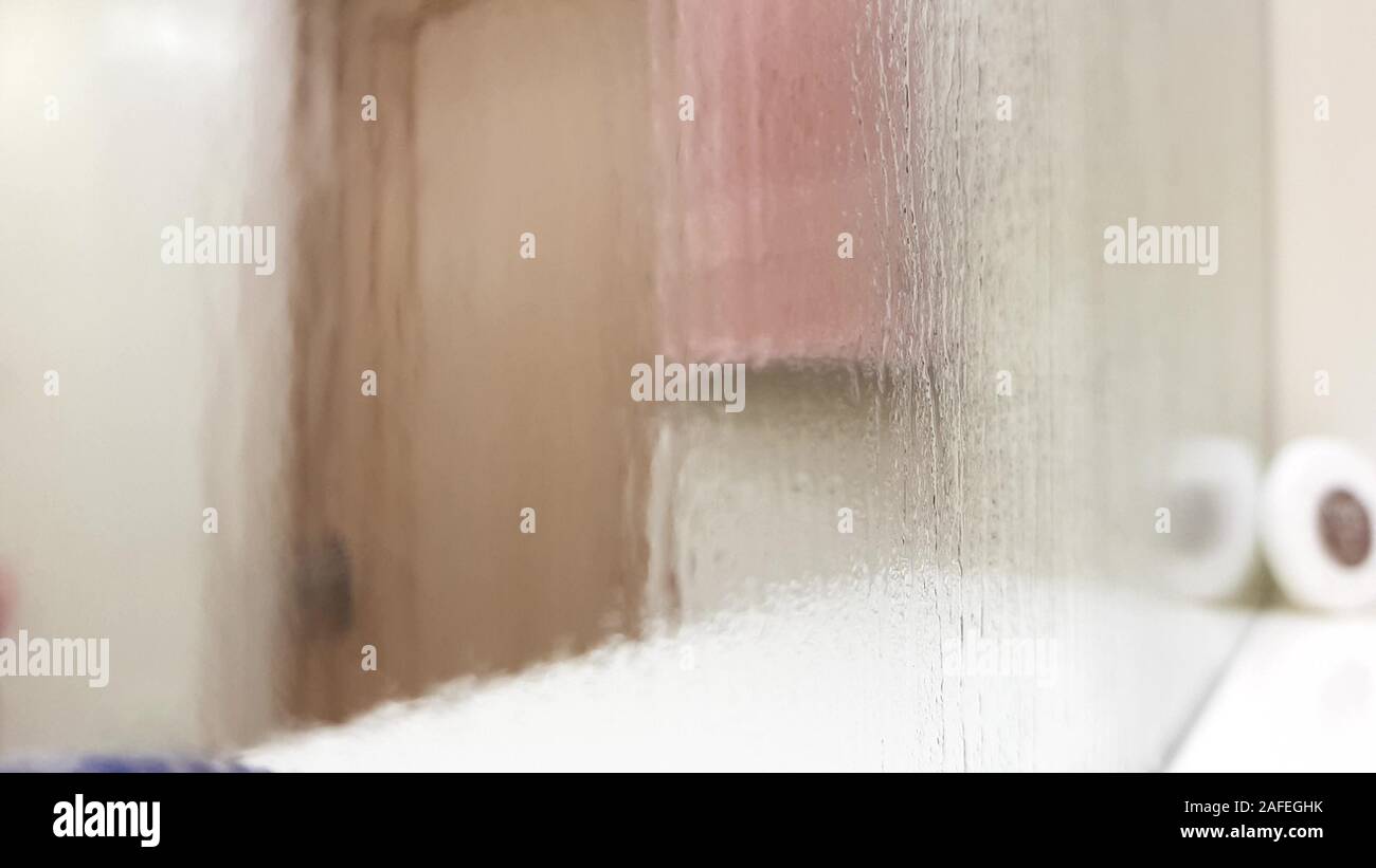 Misty wet mirror over a bathroom shelf, perspective view, blurred closeup Stock Photo Alamy