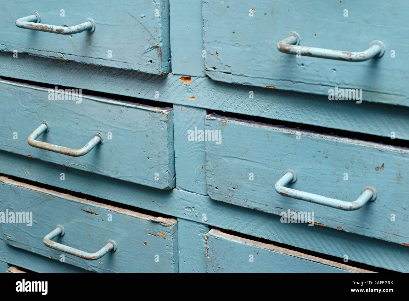 Backgrounds and textures: old blue wooden closet with drawers, close-up shot Stock Photo