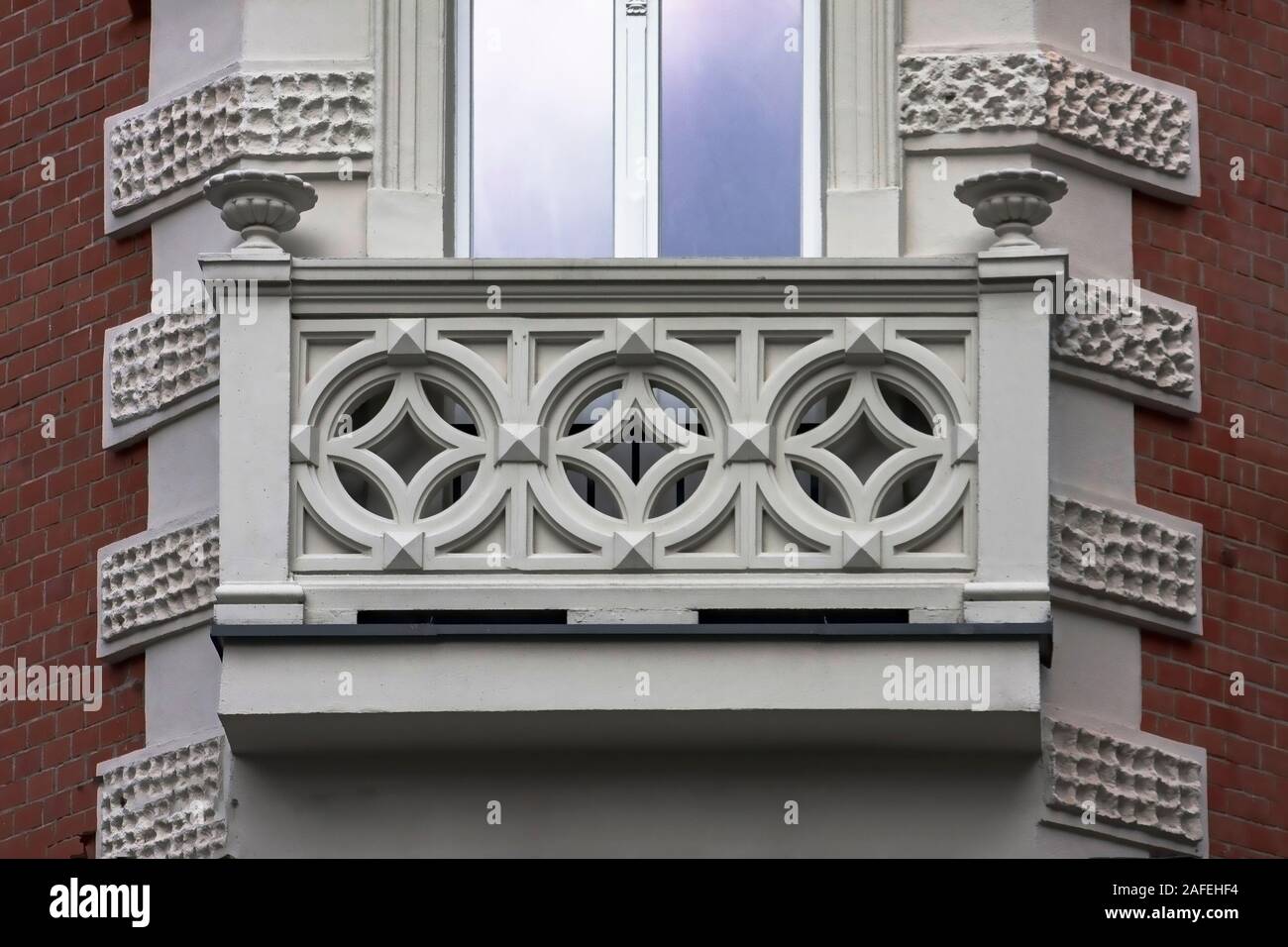 Details tenement house red brick geometric clean pattern window balcony eclectic neoclassicism wall architecture Katowice antique Stock Photo