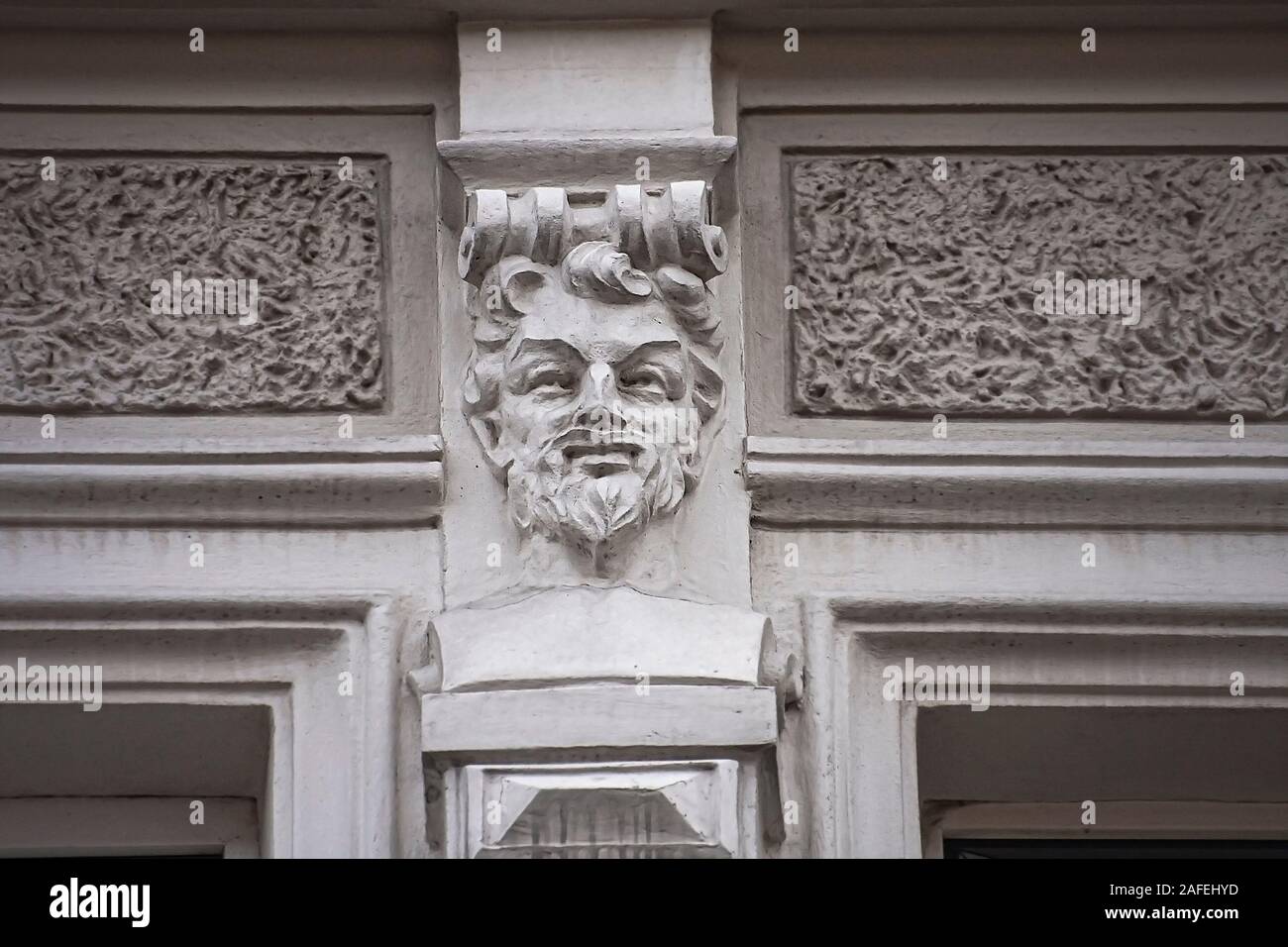 Mascaron elements of architecture, detail decorations of building wall tenement house stucco texture Katowice Stock Photo