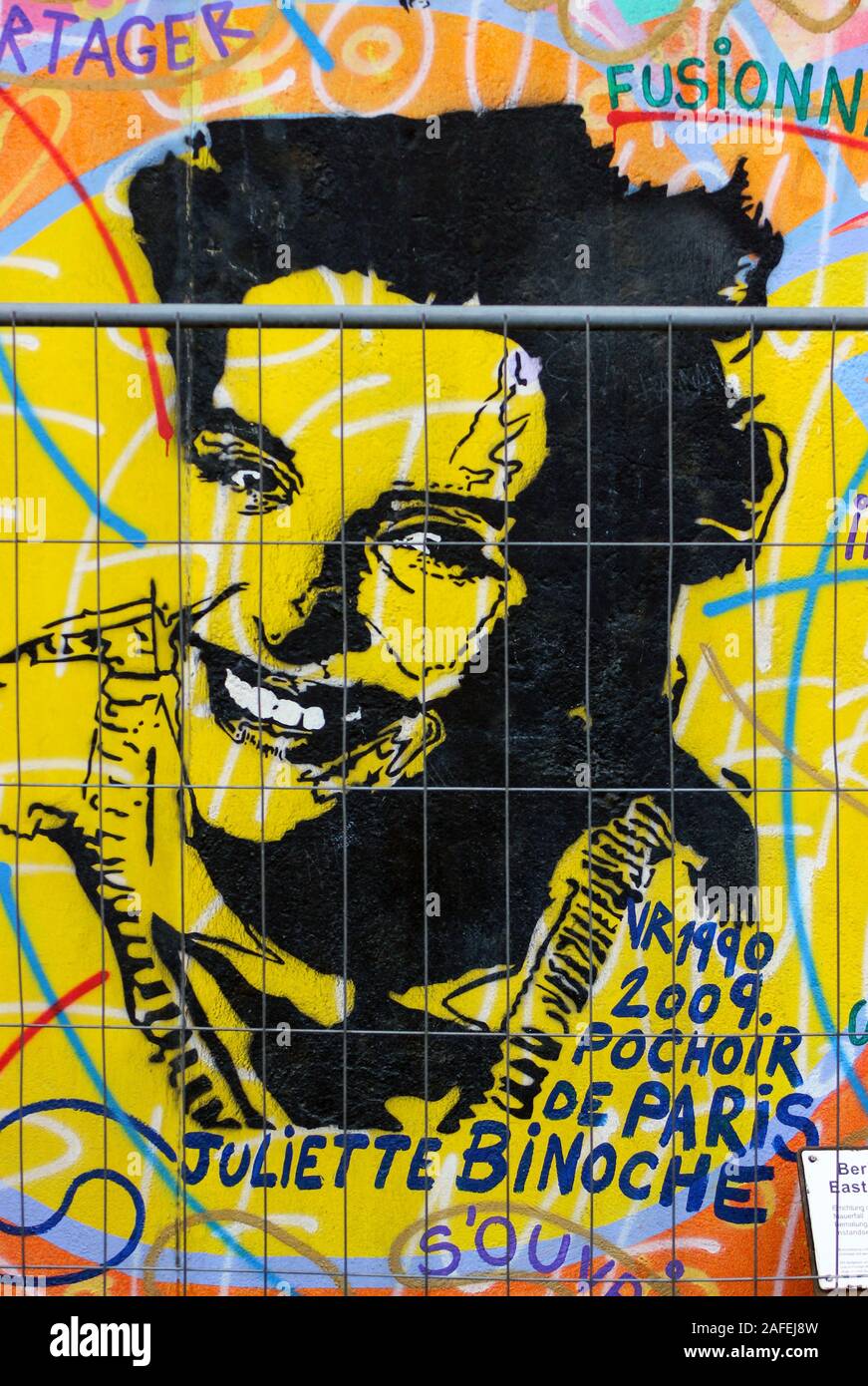 Juliette Binoche stencil graffiti on Berlin wall at East Side Gallery in Berlin, Germany Stock Photo