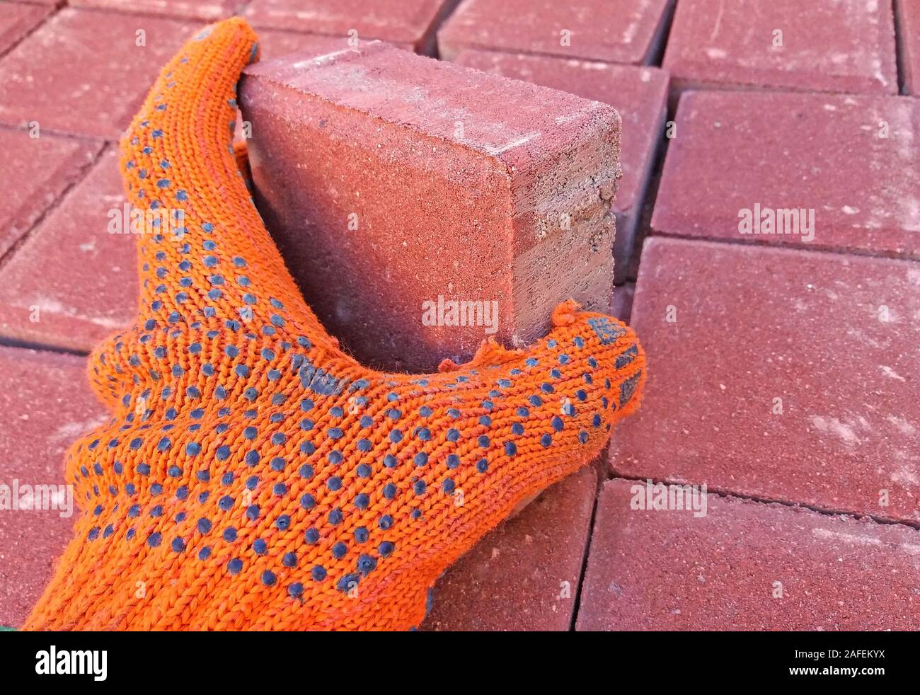 Worker is working on installing the pavement Stock Photo