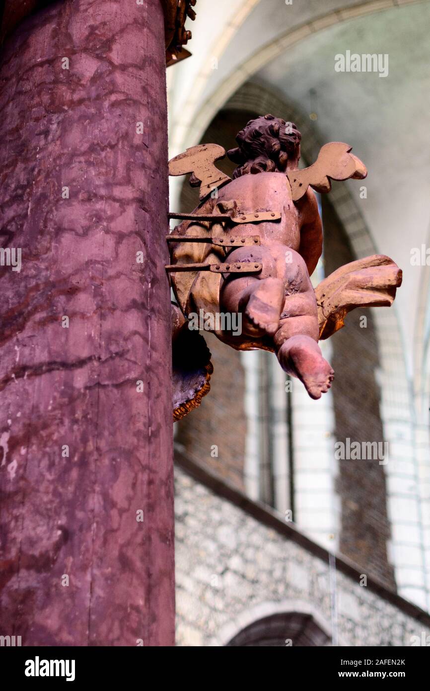 Statue of a flying putto in a Christian church Stock Photo