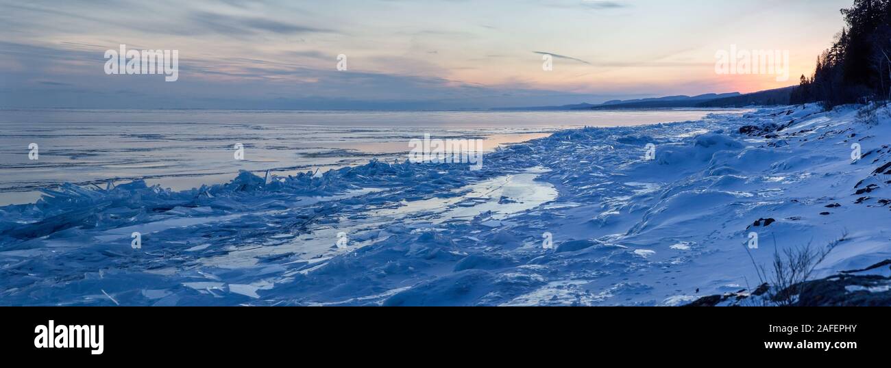 A winter sunset panorama along the North Shore of Lake Superior with ice shards piling up in Cook County, Minnesota Stock Photo