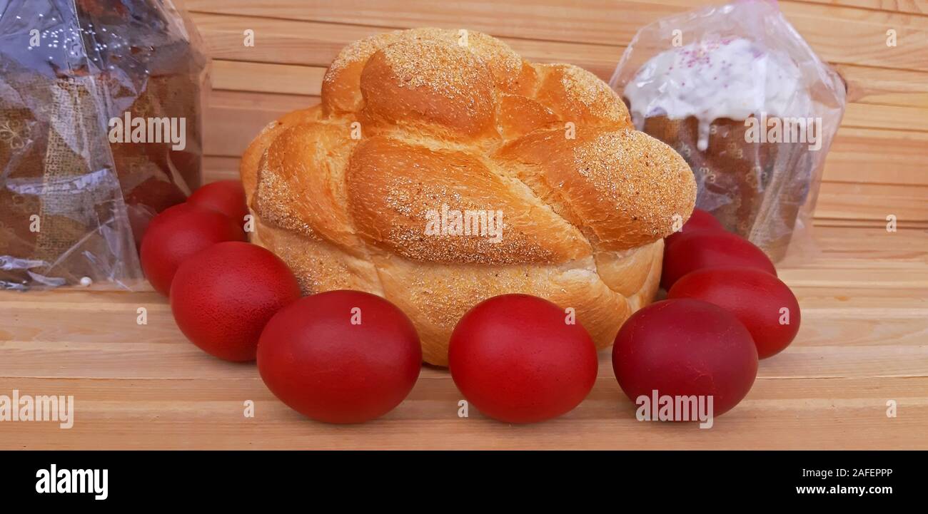 Easter red eggs and homemade bread and cakes. Easter concept Stock Photo