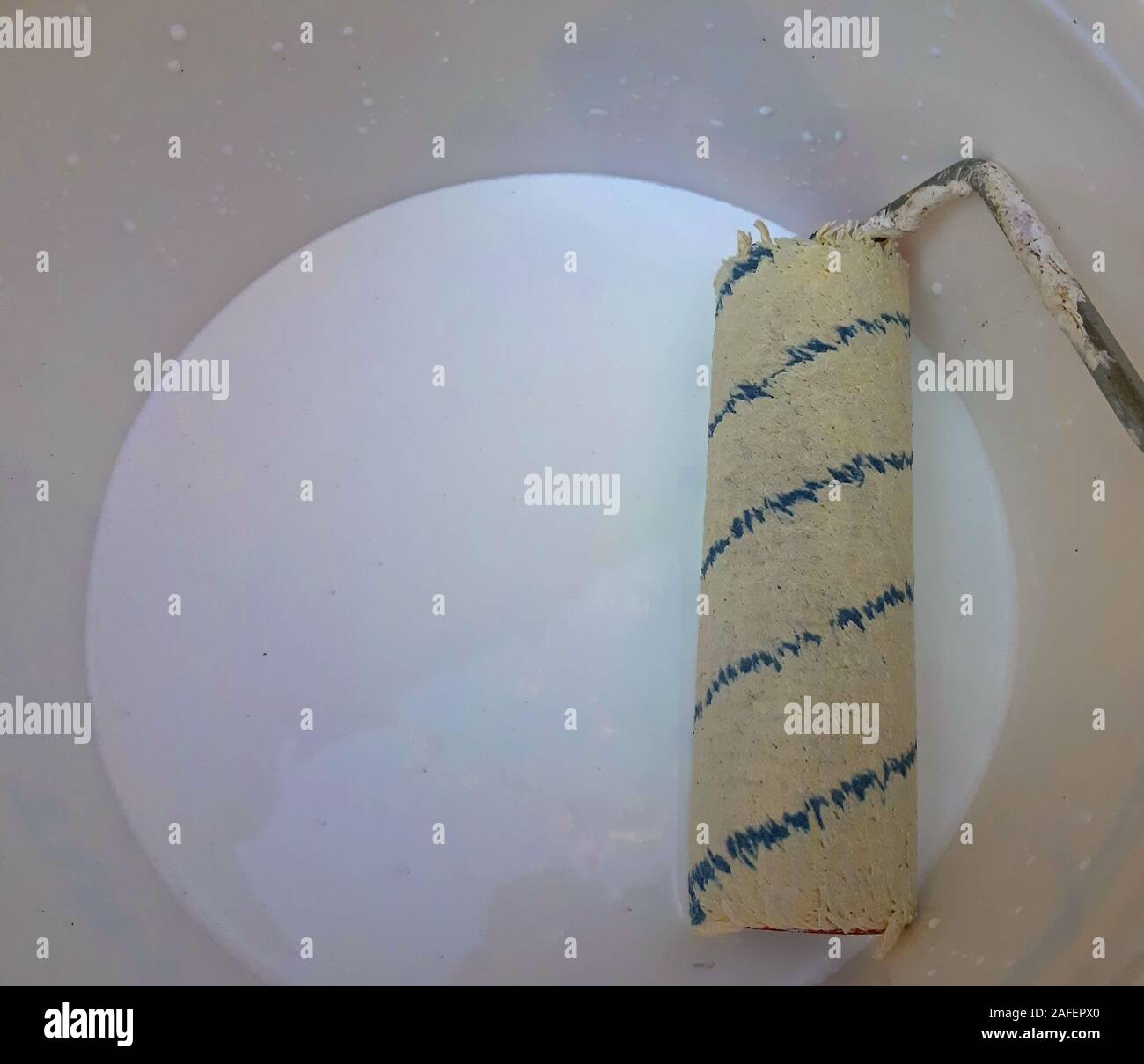 White primer paint brush in the bucket Stock Photo Alamy