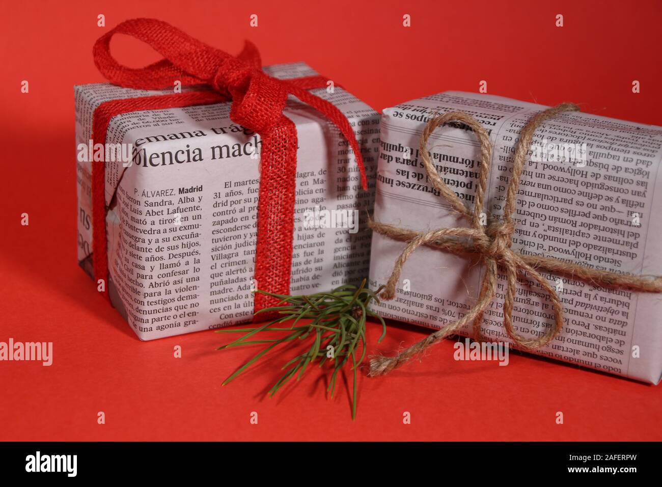 Alicante, Spain December 15, 2019 Gifts wrapped in old newspaper with