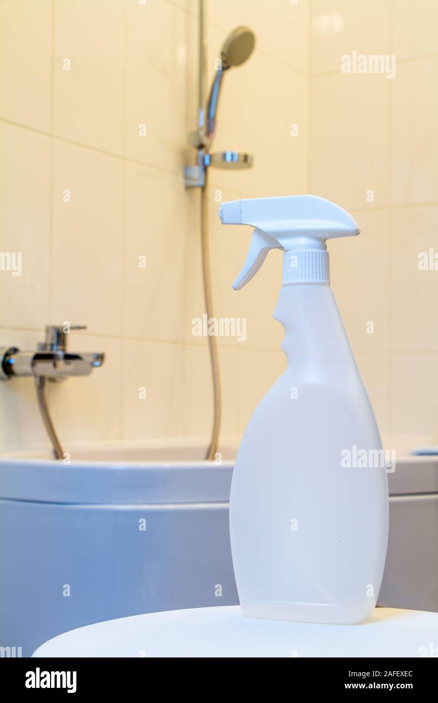 Sprayer with detergent opposite the bathroom with corner bath, faucet and shower with a long