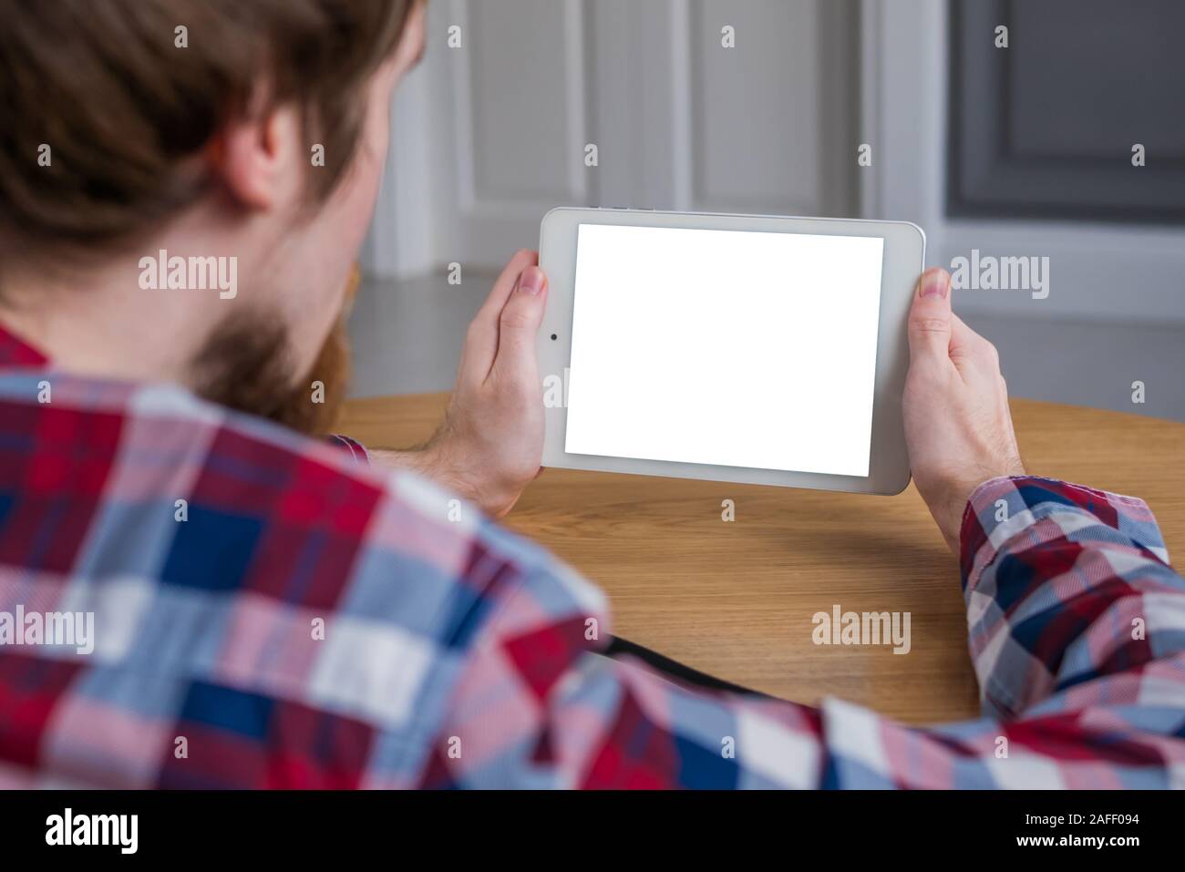 Man holding digital tablet device with white blank screen - mockup ...