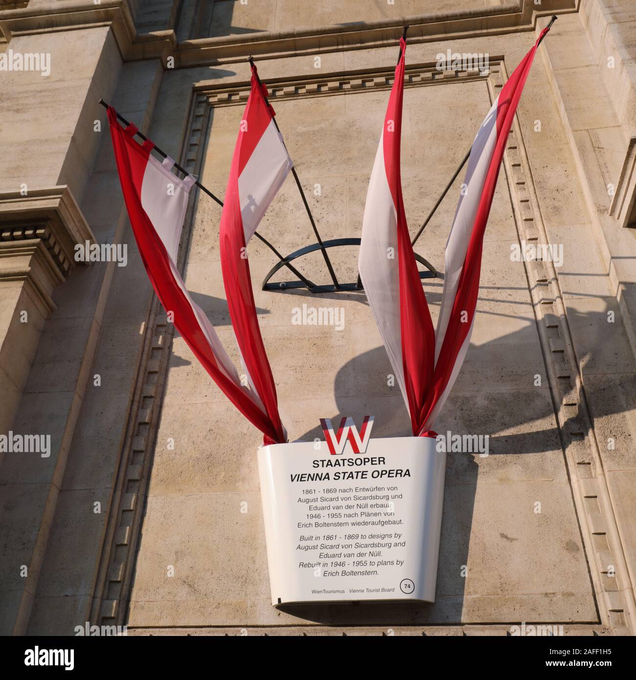 Vienna, Austria - September 16, 2018: Flags of Vienna city at the information board on the building of Vienna State Opera. Built in 1861-1869, the bui Stock Photo