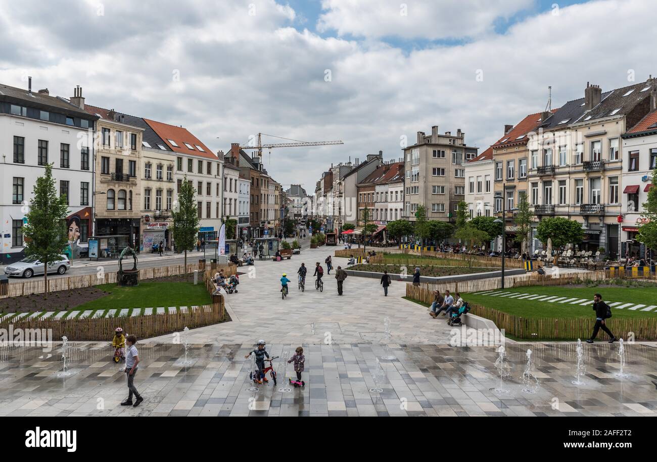 Ixelles, Brussels / Belgium - 05 31 2019: People walking at the new renovated pedestrian zone around Fernand Cocq Square in front of the town hall Stock Photo