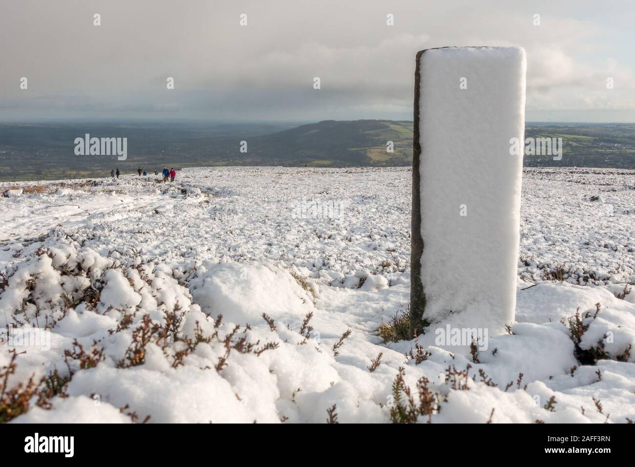 Lots or people heading uphill to find snow on the moors, Burley Moor