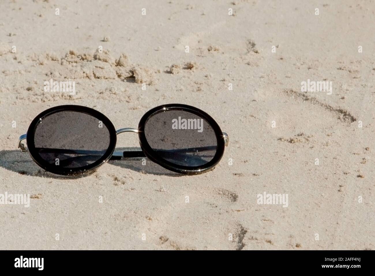 Top view of sunglasses on the beach near the blue sea with sand Stock ...