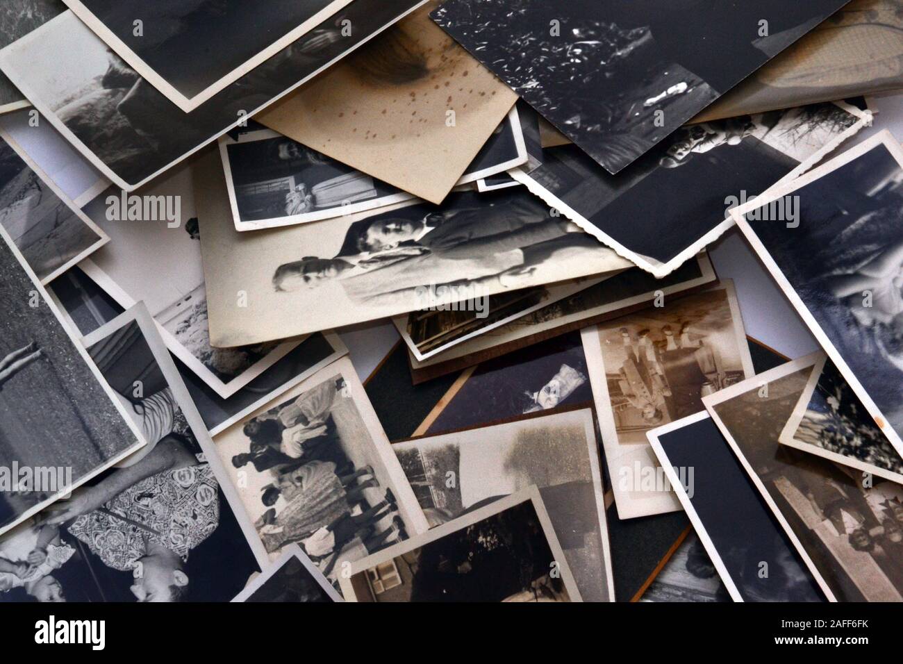 A collection of old, vintage black and white family photographic prints Stock Photo