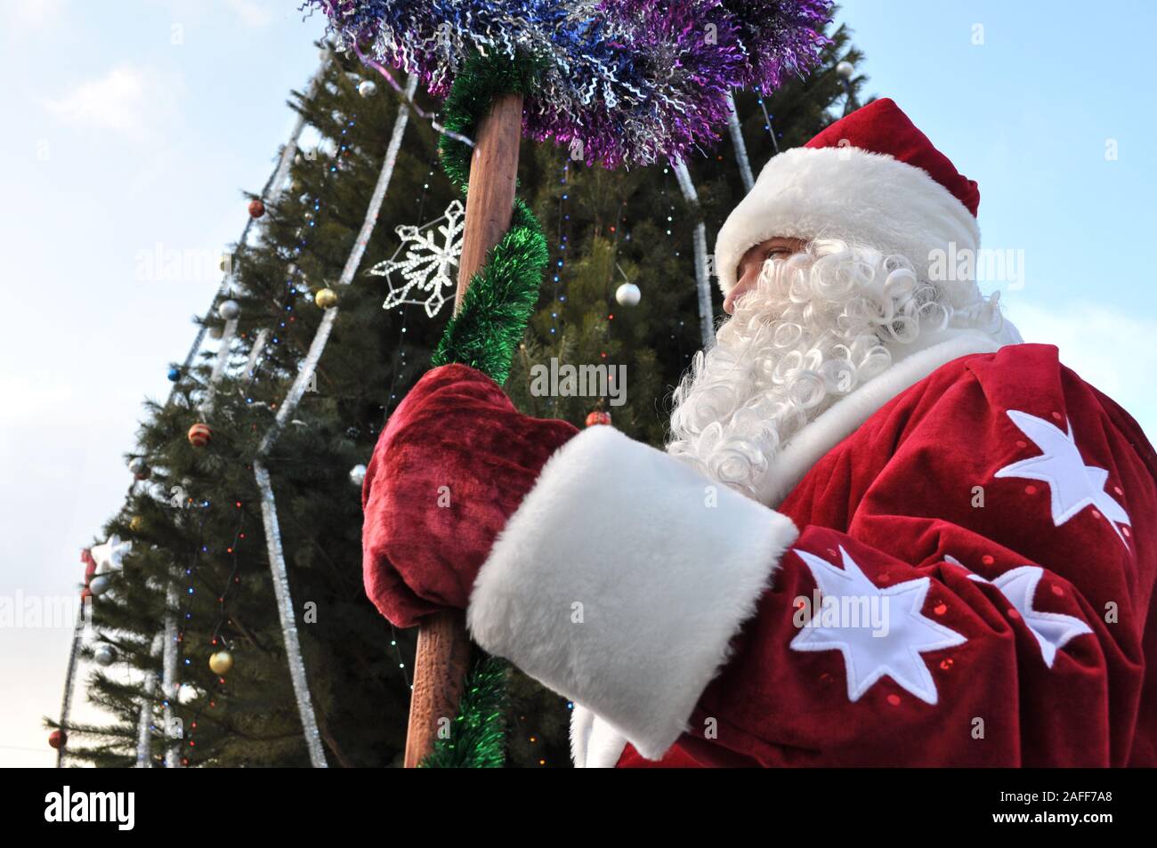 Cherkasy, Ukraine,December,24, 2011: Santa Claus  took part in New year show in the city square near the Christmas tree Stock Photo