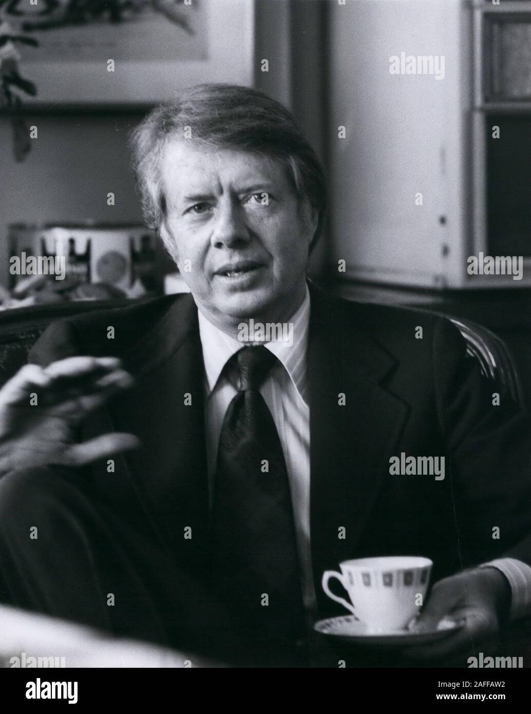 Usa. 03rd Mar, 1976. Presidential hopeful, Georgia Governor JIMMY CARTER holds a cup of tea or coffee. Exact place unknown. Credit: Keystone Pictures USA/ZUMAPRESS.com/Alamy Live News Stock Photo