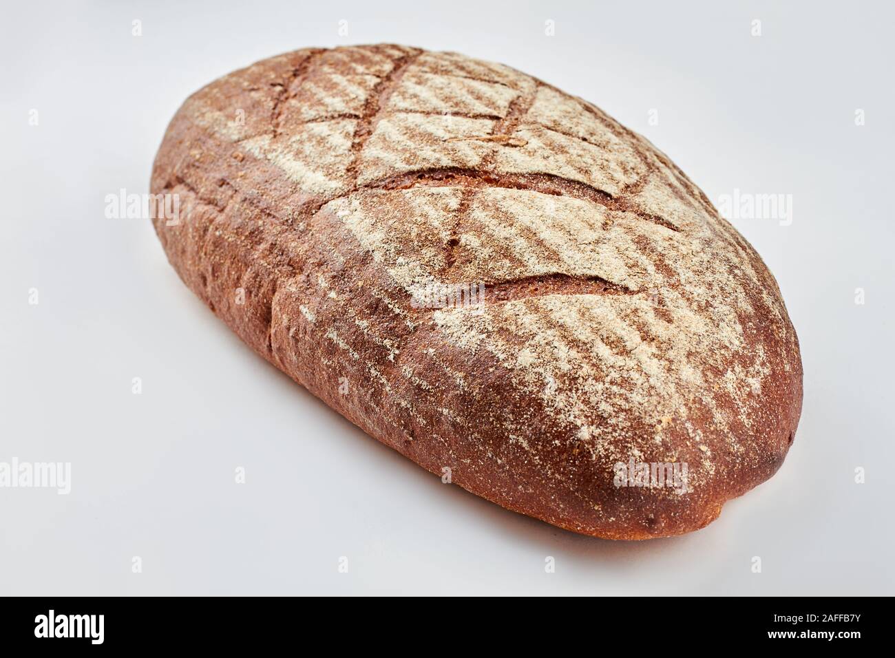Loaf of bread on white background Stock Photo - Alamy
