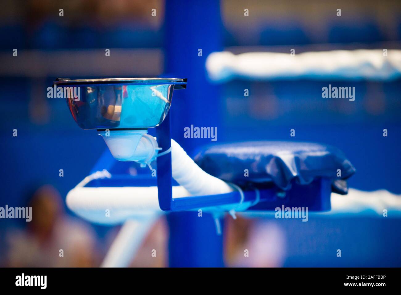 Another view for a corner of boxing ring. Chair, bucket,  tray are setup in a corner of boxing ring Stock Photo