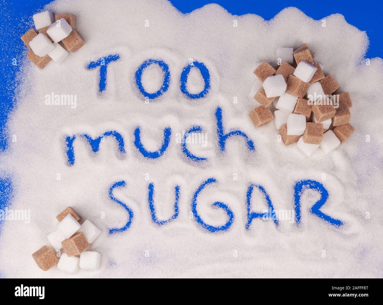 The word too much sugar written in sugar grains Stock Photo - Alamy