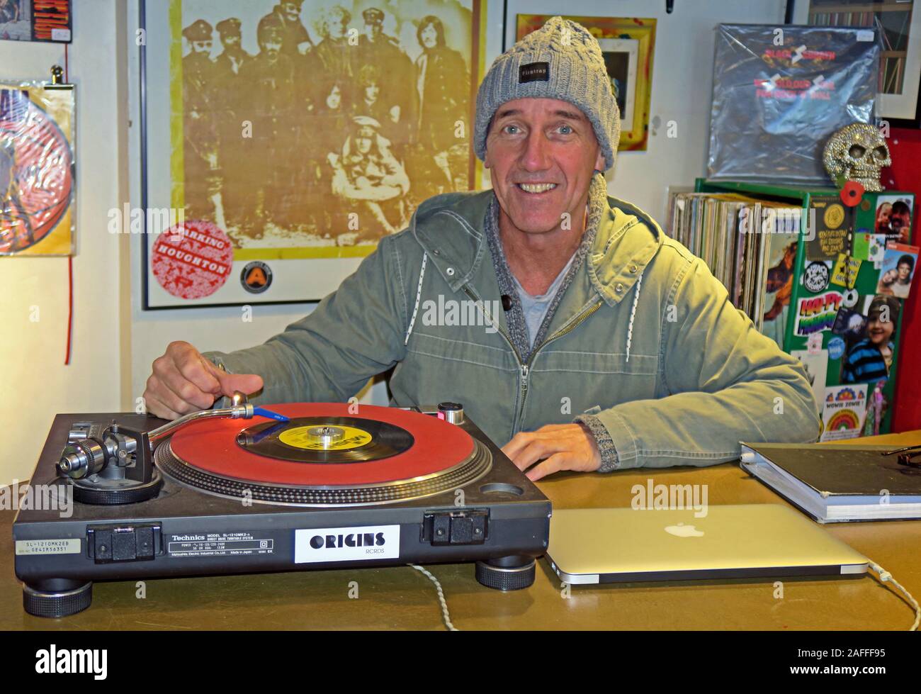 Owner,Lizard Inc Records,Independent Record Shop,Legh St, Warrington,Cheshire,England,UK, WA1 1UG,playing a single Stock Photo